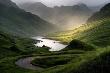 Mountain valley bathed in golden light, winding road