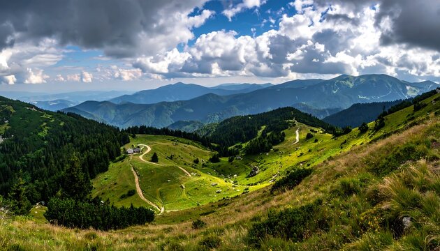 Panoramic vista of rolling green hills, lush forest, and distant mountains