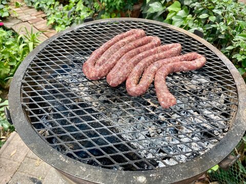 Boerewors on an outdoor braai - traditional South African weekend lifestyle