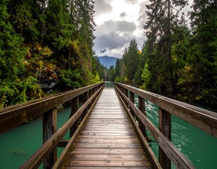 Wooden bridge over turquoise water surrounded by trees and mountains