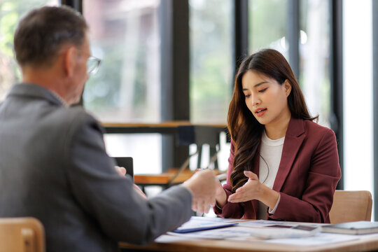 Businesswoman discussing strategy with client in office