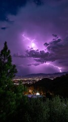 Obraz premium Spectacular night lightning storm over city with dramatic purple sky and illuminated landscape