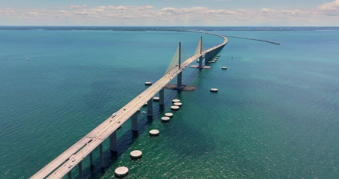 Cars driving on Sunshine Skyway Bridge over Tampa Bay in Florida. Transportation infrastructure in America