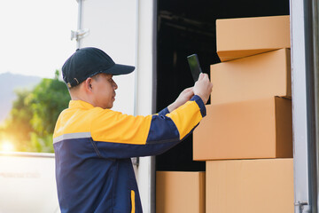 Warehouse Worker Scanning Barcodes on Delivery Boxes with Mobile Device in Outdoor Environment
