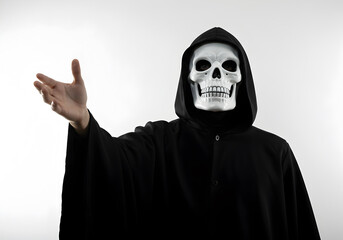 Eerie image of a grim reaper figure in a black hooded robe with a skull mask on a white background, Halloween or a horror movie concept