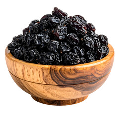 Close-up of a wooden bowl overflowing with dark, dried fruit against a black background