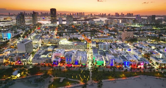 Historic Ocean Drive in Miami Beach with illuminated hotels, restaurants and tropical ambiance. Evening scene.