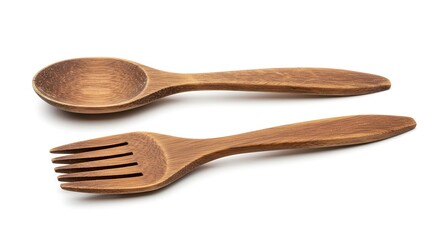 Isolated wooden spoon and spork on white shows natural texture and craftsmanship.