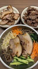 Delicious Korean Bibim Guksu with Pork and Vegetables.