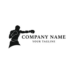 Fototapeta premium Silhouette of a boxer throwing a punch, perfect for sports-related branding and logos.