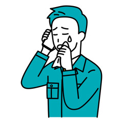 スマートフォンでの通話で泣く作業員の男性