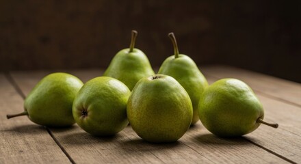 Group of green pears on a rustic wooden surface, capturing freshness