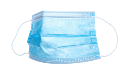 Close-up of a pleated, light blue medical mask, with ear loops, isolated on black