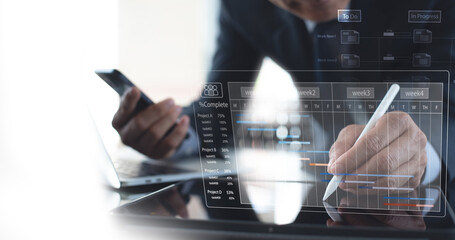 Project manager working with Gantt chart planning schedule, tracking milestones and updating tasks progress, scheduling and management skills, program strategy, project management concept