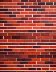 Fototapeta premium Close-up shot of a vibrant red brick wall