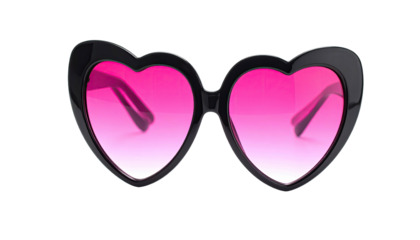 Close-up shot of black heart-shaped sunglasses with pink lenses on black background