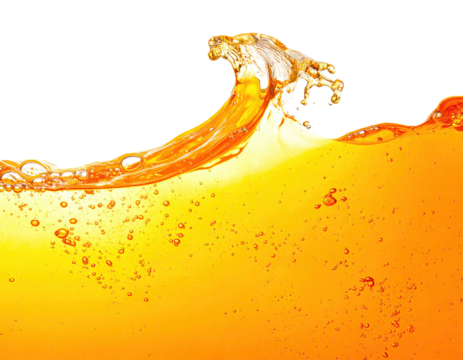 A golden liquid splashes with a wave-like crest, bubbles visible, dark background