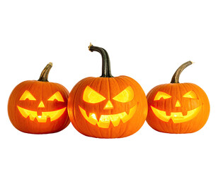 Three glowing jack-o'-lanterns with various carved faces against a black backdrop