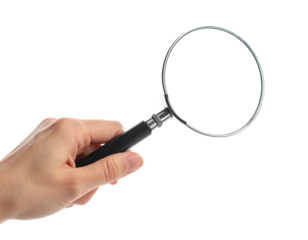 A human hand holds a magnifying glass against a black background, isolated