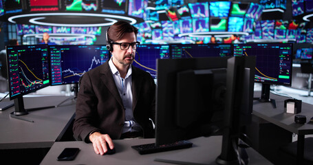 Senior Trader Monitoring Stock Market Screens Online