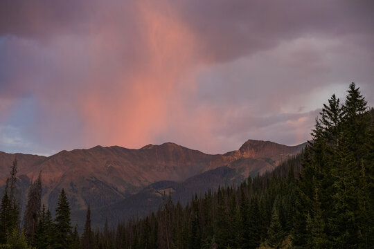 sunset rain over distant mountains
