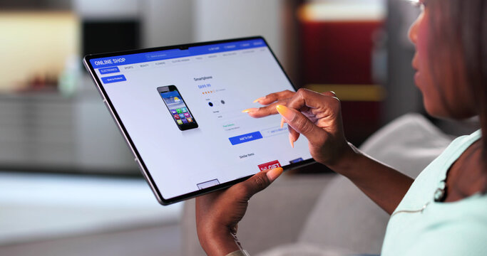 Online Shopping With African American Woman On Tablet Computer - Powered by Adobe