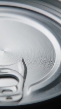 Close Up Silver Beverage Can Showing Circular Texture and Pull Tab