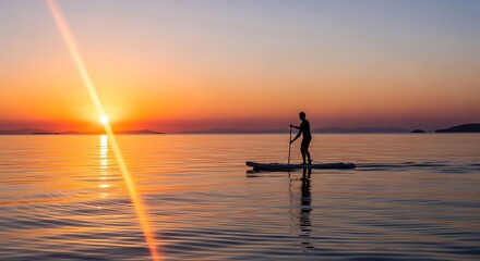 Paddleboarding at Sunset - A Serene Water Adventure.