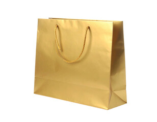 Gleaming golden paper shopping bag, isolated, featuring rope handles, against black