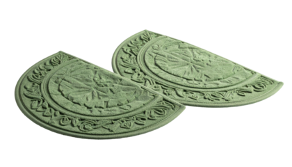 Two matching semi-circular, patterned objects in a pale green hue, isolated