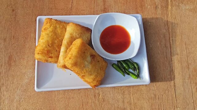 french toast and coffee Risole,Rissoles,Risol is snack fiiled with vegetables,smoked beef,sausage,cheese,mayonnaise sauce,wrapped in risol skin and bread crumbs served with green cayenne pepper and ch