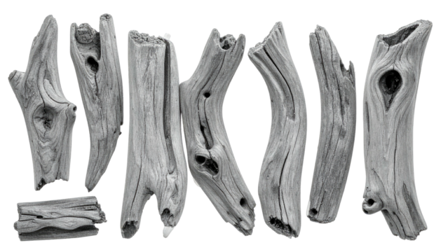Seven weathered wooden pieces of varying shapes and sizes, in shades of gray