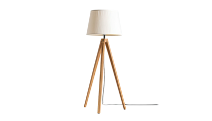 A wooden tripod floor lamp with a white shade isolated against a black background