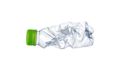 Crumpled, transparent, plastic bottle with green cap against a solid black background