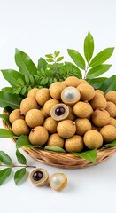 Fresh Longan Fruit in Basket with Green Leaves on White Background.