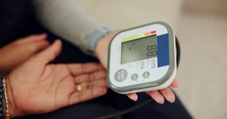 Healthcare, hands and monitor for blood pressure test in home for medical examination and hypertension. Nurse, professional and patient with machine for reading or screening of diabetes diagnosis - Powered by Adobe