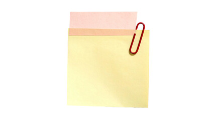 Two sticky notes, pink and yellow, clipped by a red paperclip, on black