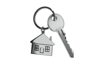 Shiny metal keys with house charm against black backdrop, suggesting property access