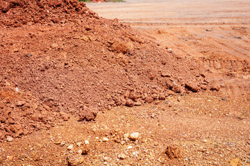 Earthy landscape of red soil construction site outdoor view at ground level
