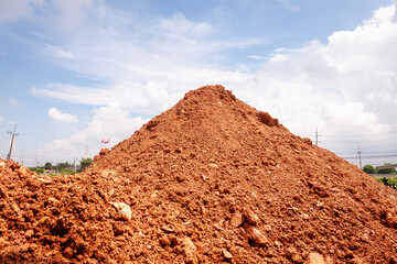 Excavation process at construction site urban area sunny weather ground level industrial growth