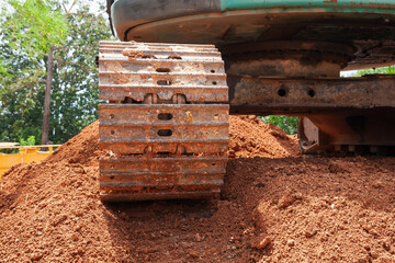 Construction equipment operating soil pile outdoor site industrial natural environment close-up view
