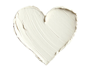 Creamy white substance shaped like a heart, against a stark black background