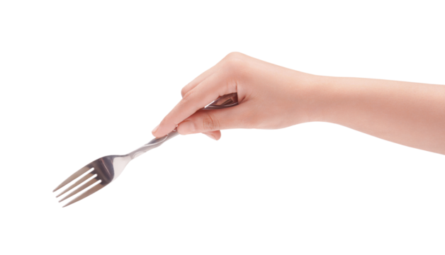 Female hand holding a shiny silver fork, isolated