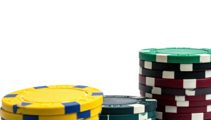 Close-up view of poker chips stacked in various colors on a black background