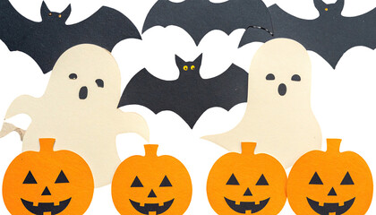 Festive arrangement with paper-cut pumpkins, ghosts, and bats on a dark background