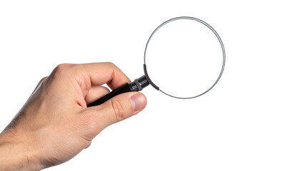 Human hand holding a magnifying glass against a black background