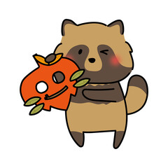 落ち葉のお面を持つタヌキ