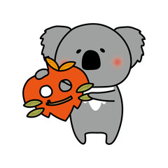 落ち葉のお面を持つコアラ