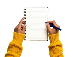 Dark-skinned hands writing in a spiral notebook; the person wears a yellow sweater