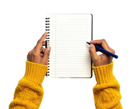 Dark-skinned hands writing in a spiral notebook; the person wears a yellow sweater